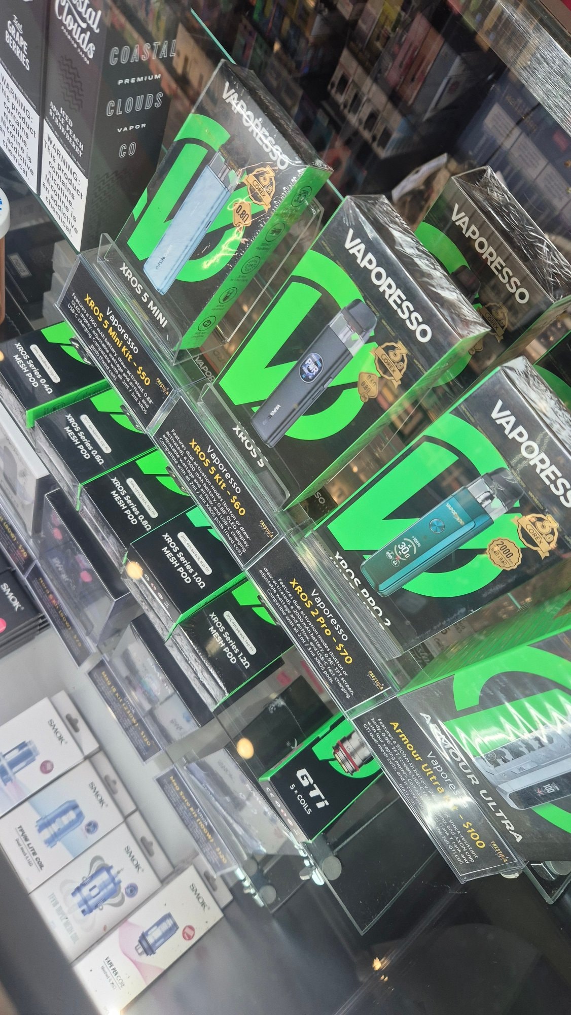Vaporesso XROS pod kits and XROS mesh replacement pods on the shelf.